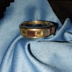 Variety of different stones set in solid yellow gold